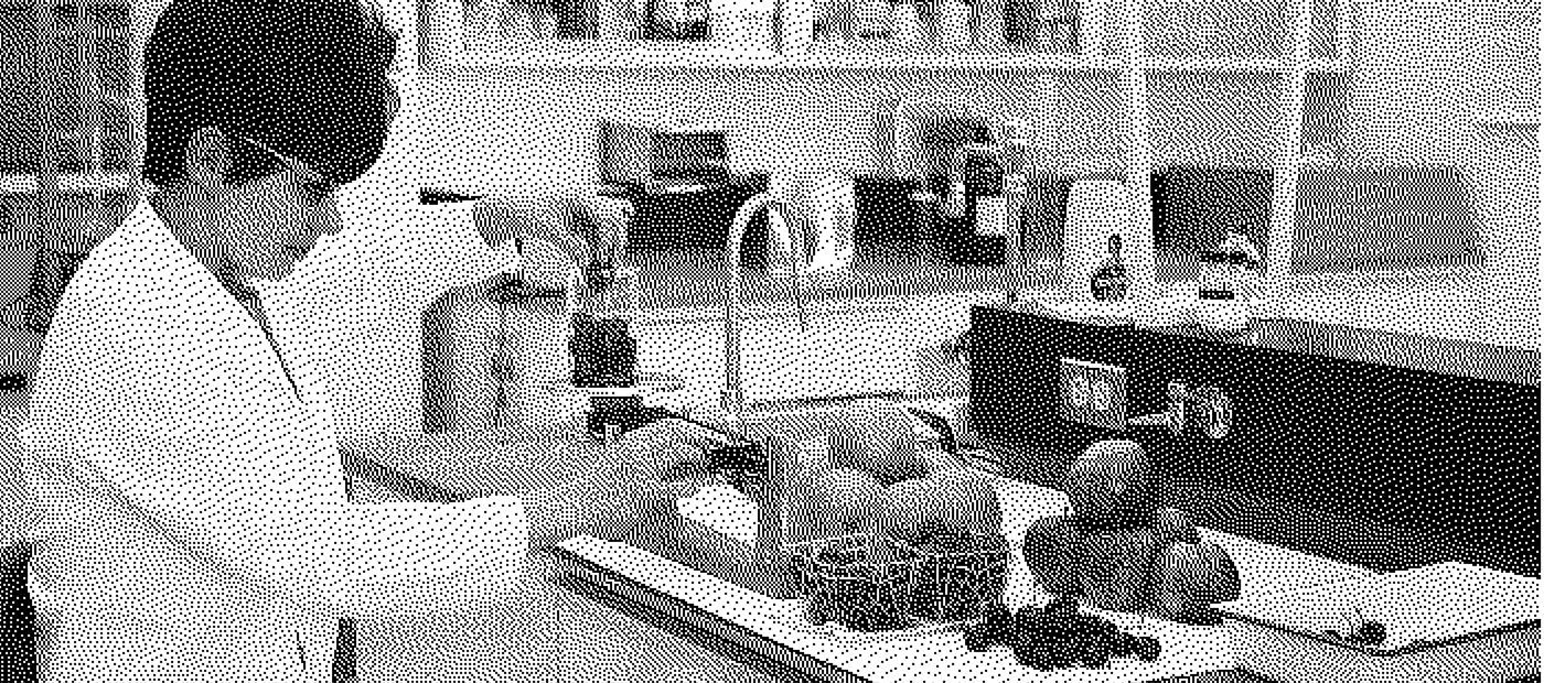 Vintage photo of a woman scientist working in a lab.